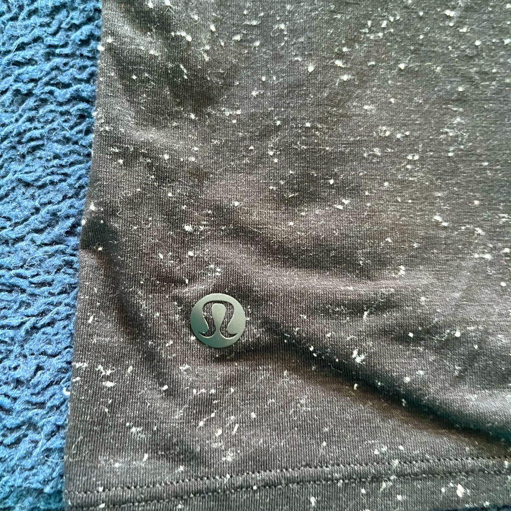 Ladies front tie mock neck black speckled top